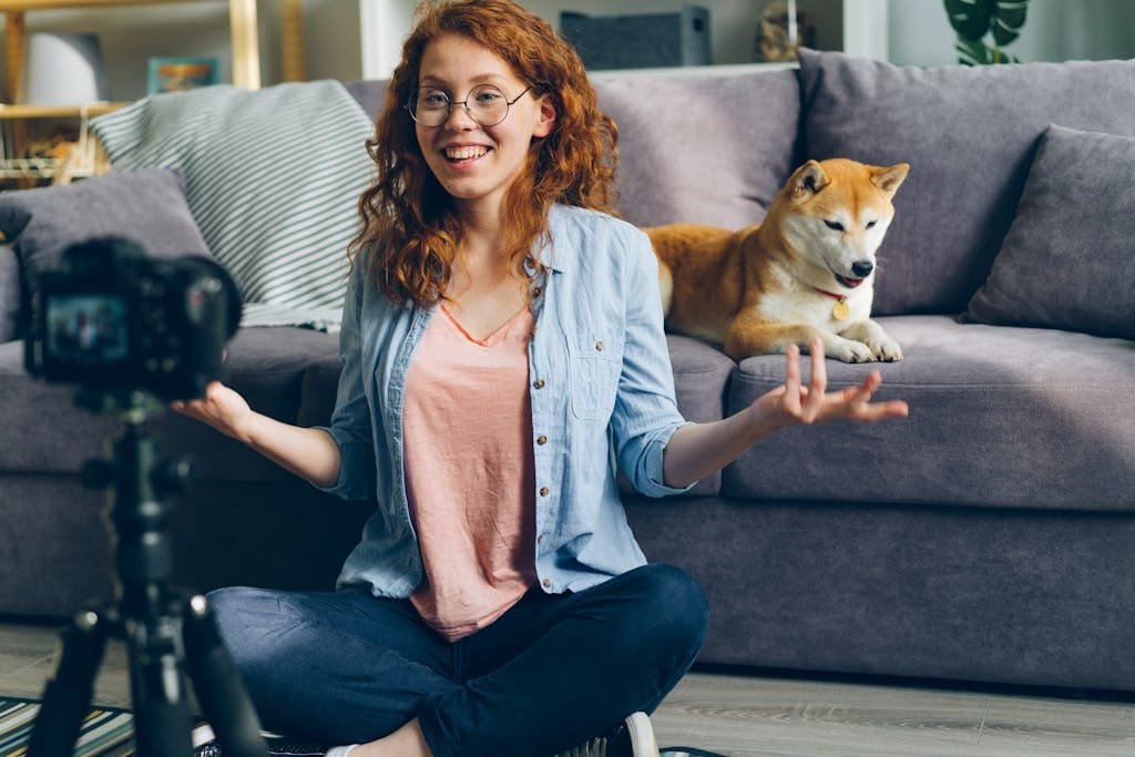 Smiling Woman Sitting on Floor in front of Camera